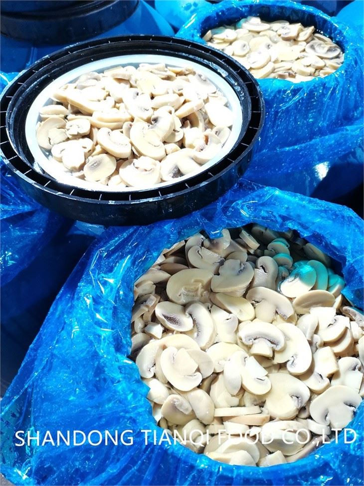 Sliced white mushroom preserved in brine in drums